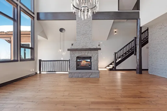 a view of a kitchen with a sink and a fireplace