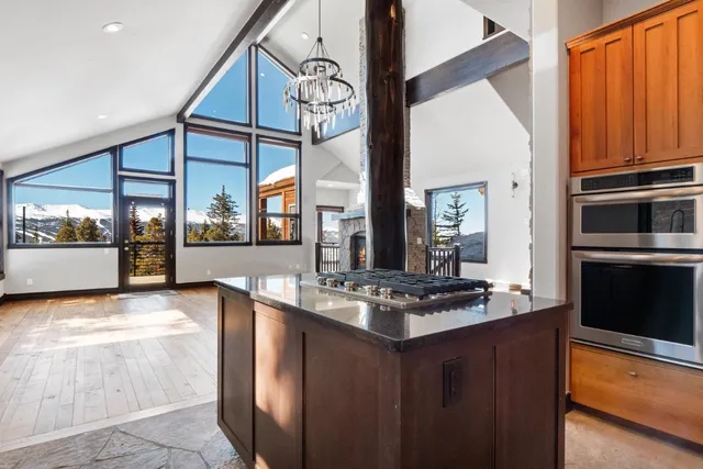 a kitchen with granite countertop a stove and a sink