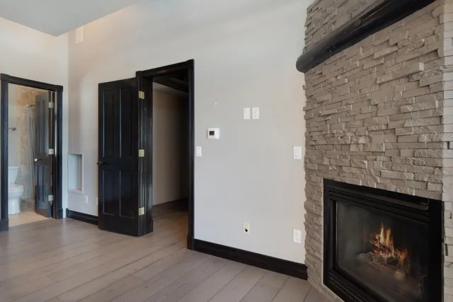 a view of a glass door with a balcony from a window