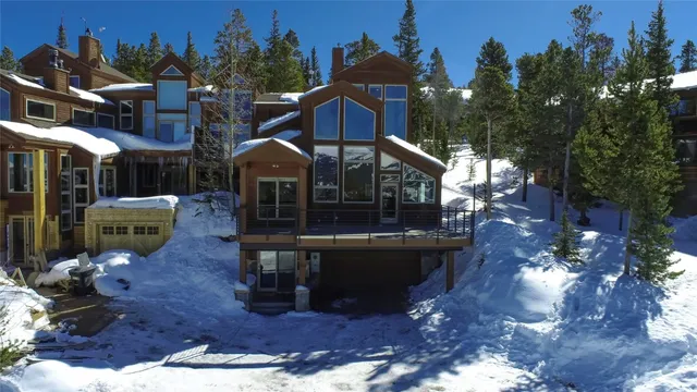 a view of a house with backyard water fountain and sitting area