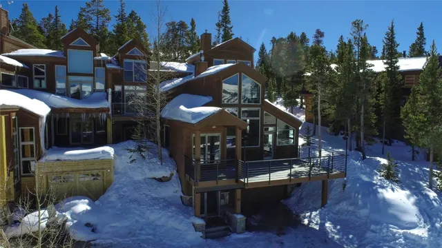 a front view of a house with outdoor seating