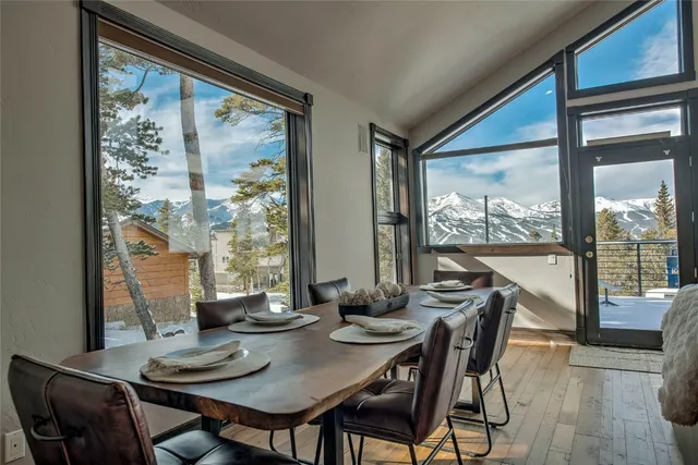 a view of a dining room with furniture and window