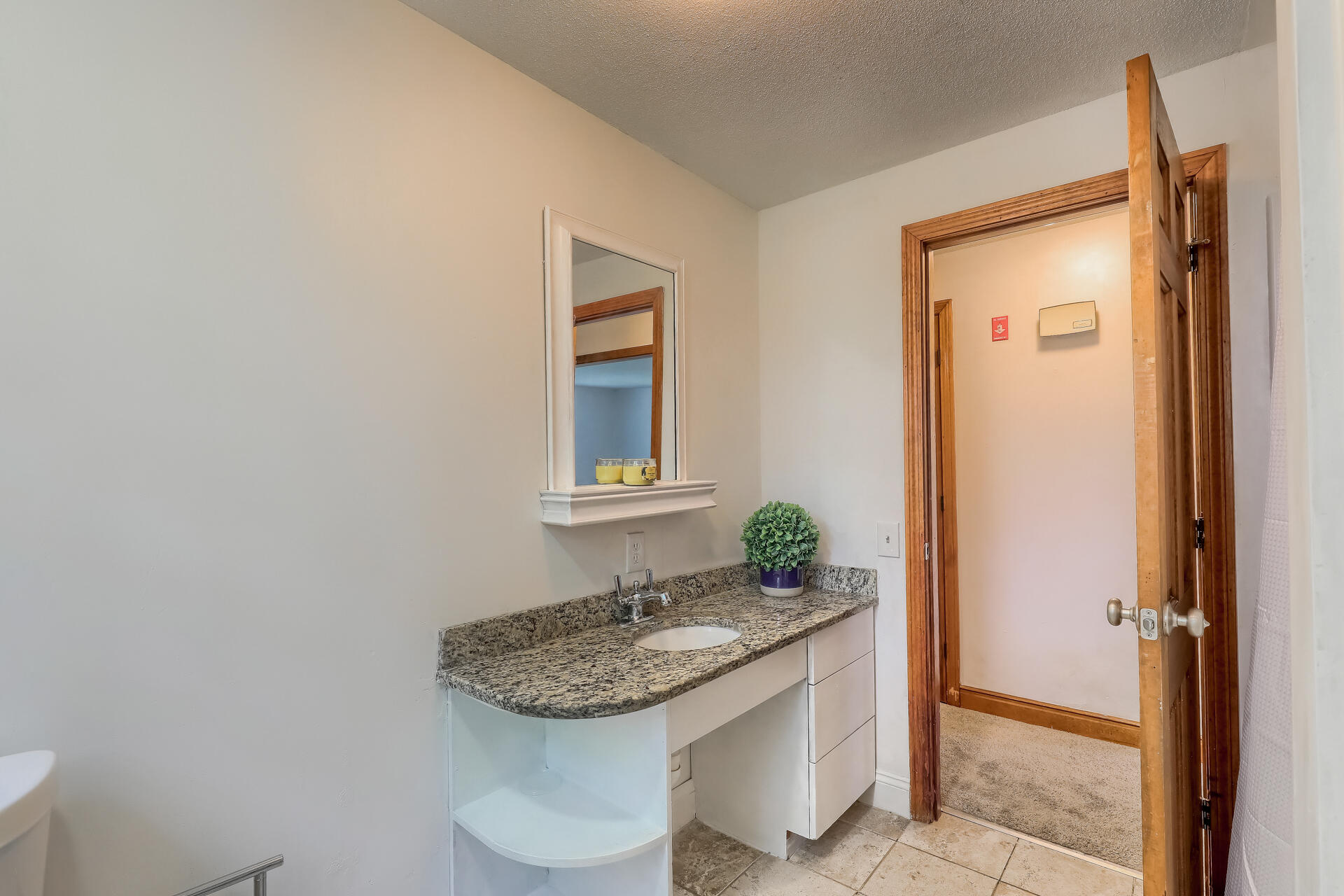 18 Crowell Road Sandwich, MA 02563 - Photo 26 of 31 a bathroom with a granite countertop sink and a mirror