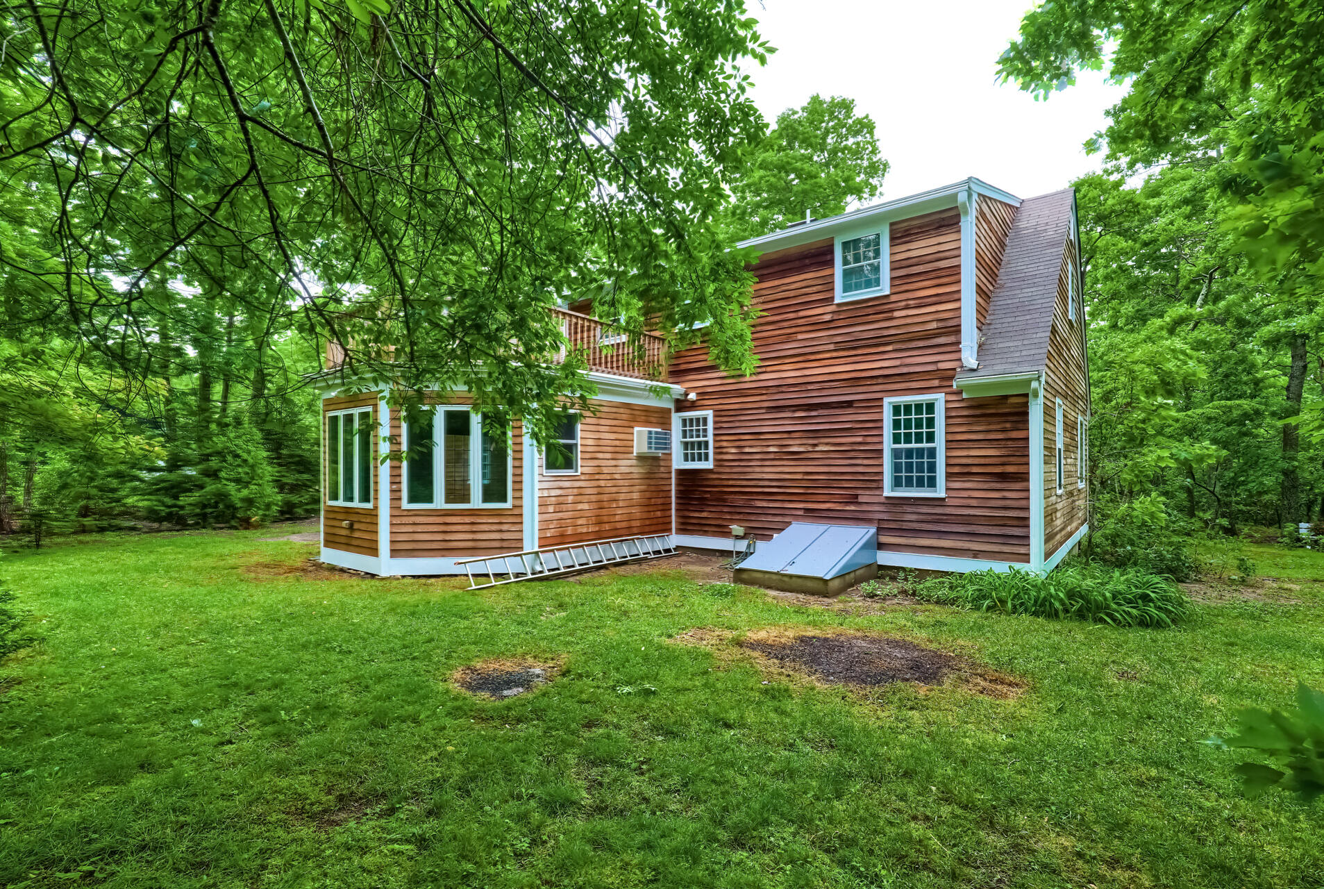 18 Crowell Road Sandwich, MA 02563 - Photo 31 of 31 a view of a house with a yard and sitting area