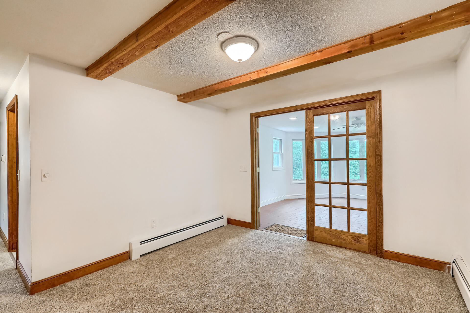18 Crowell Road Sandwich, MA 02563 - Photo 10 of 31 a view of an empty room with a window