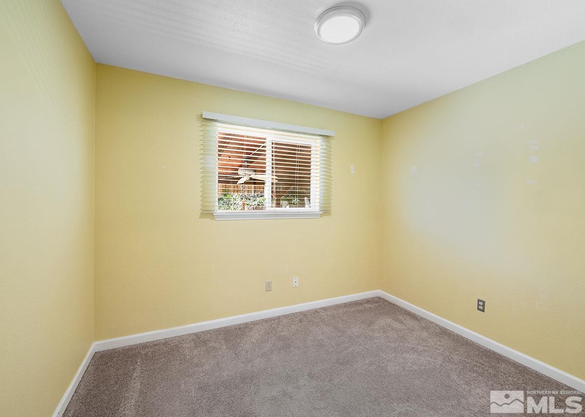 7501 Essex Way Reno, NV 89506 - Photo 11 of 15 an empty room with a window