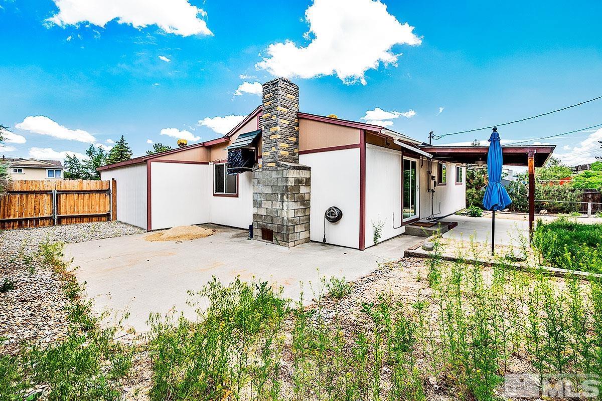 7501 Essex Way Reno, NV 89506 - Photo 14 of 15 a house with a yard