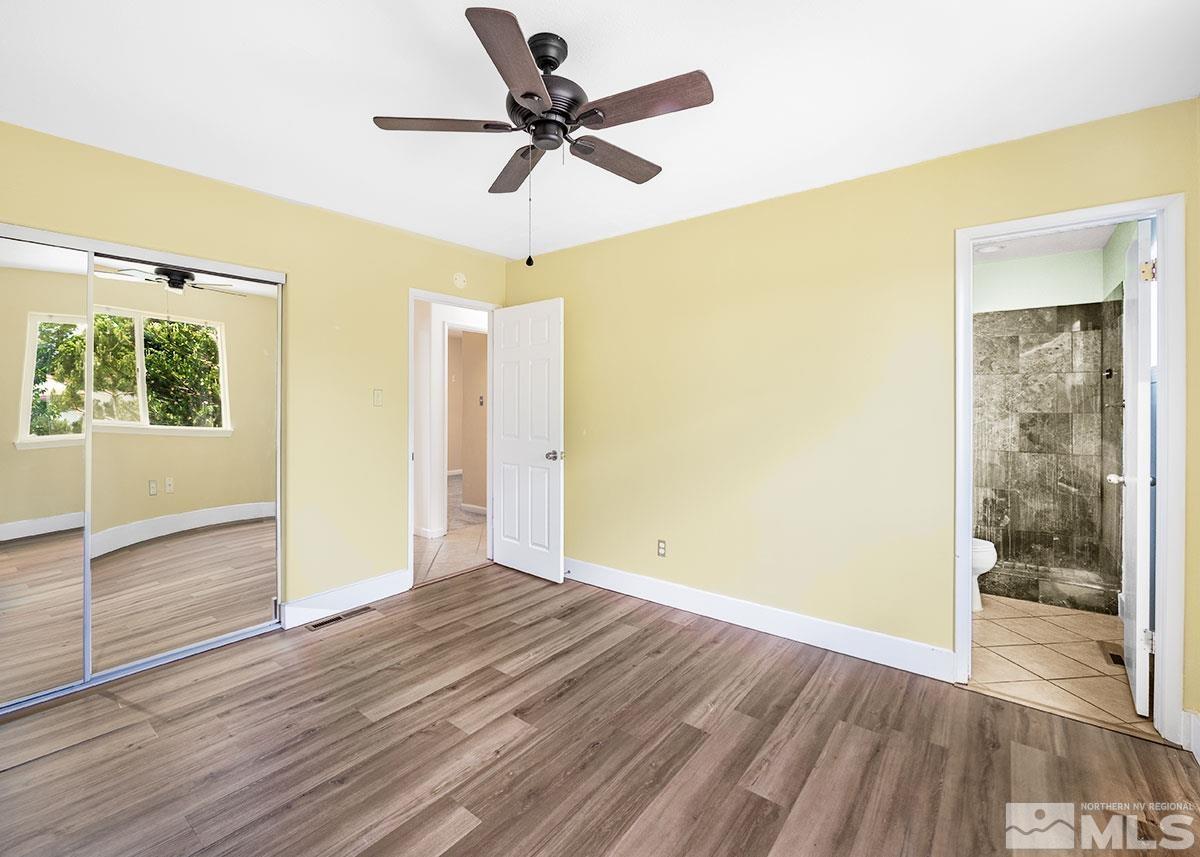 7501 Essex Way Reno, NV 89506 - Photo 6 of 15 a view of empty room with wooden floor