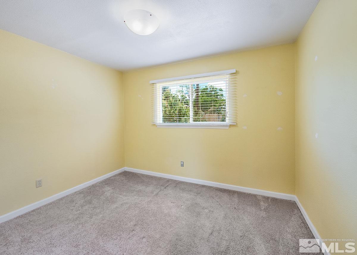 7501 Essex Way Reno, NV 89506 - Photo 9 of 15 an empty room with windows