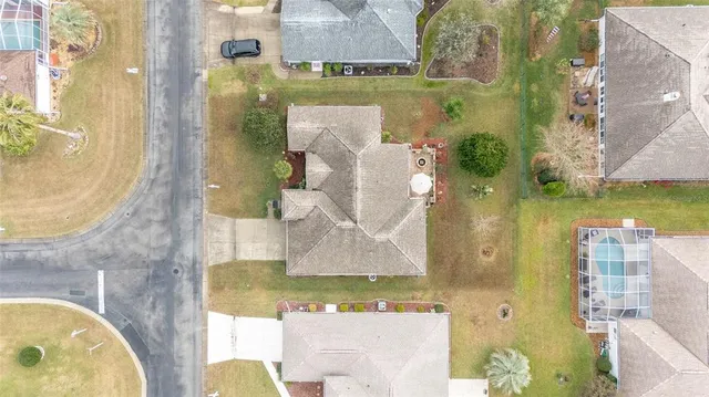 a view of a dining room with furniture and a chandelier