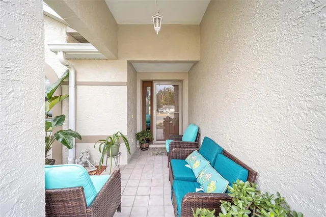 a view of a dining room with furniture and a window