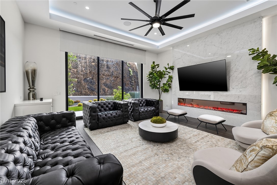 611 Cityview Ridge Drive Henderson, NV 89012 - Photo 45 of 66 Warmth meets modern architectural design with a sleek fireplace wall and high-end finishes.