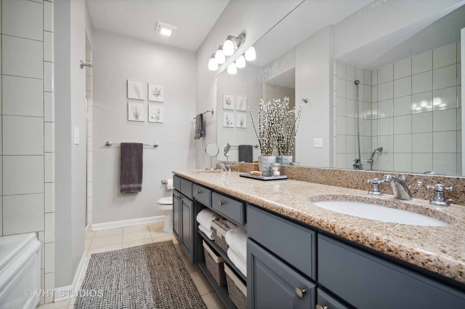 3124 North Seminary Avenue, Unit 1 Chicago, IL 60657 - Photo 15 of 25 a bathroom with a double vanity sink and a mirror