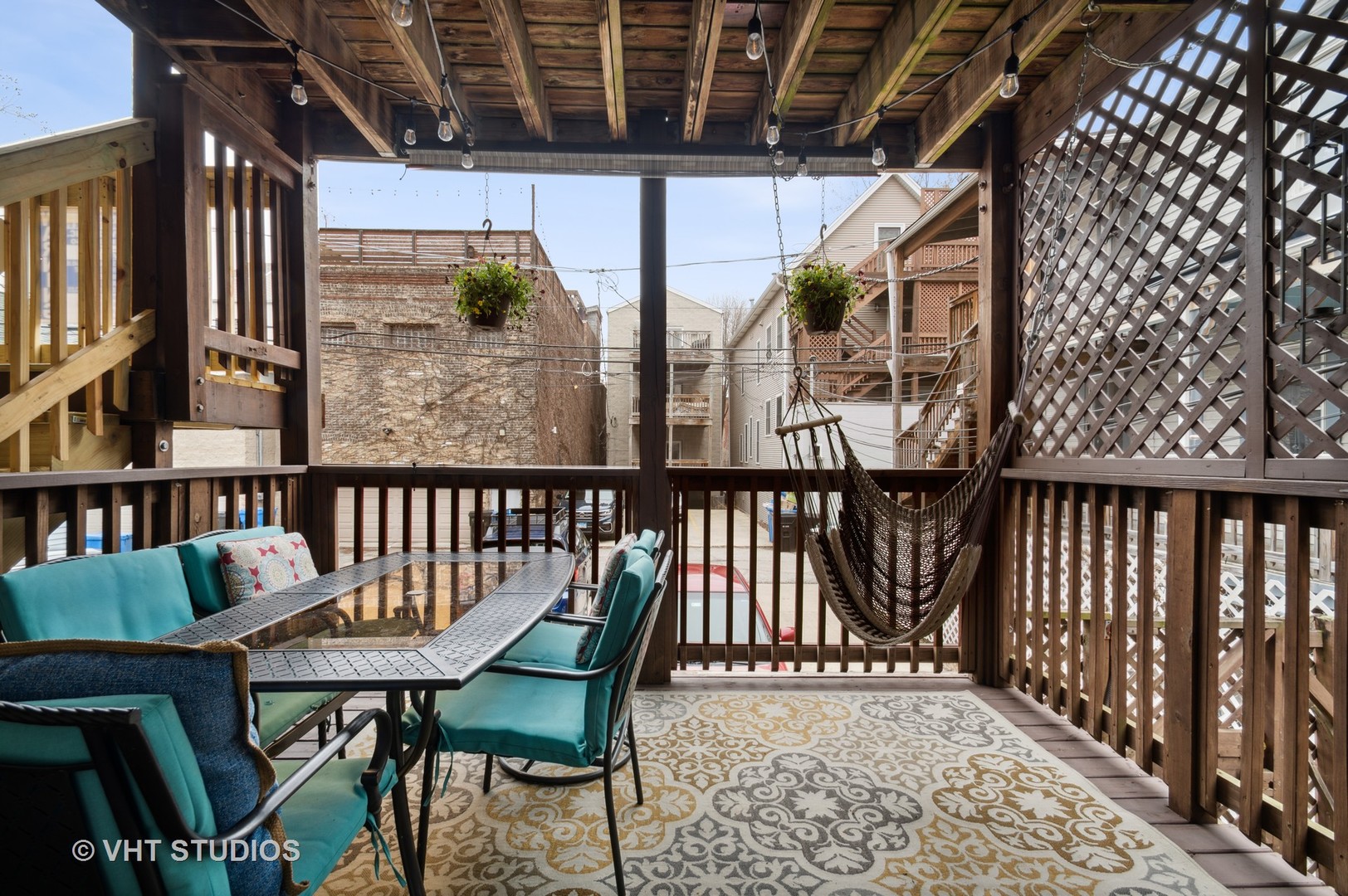 3124 North Seminary Avenue, Unit 1 Chicago, IL 60657 - Photo 20 of 25 a balcony with wooden floor outdoor seating and city view