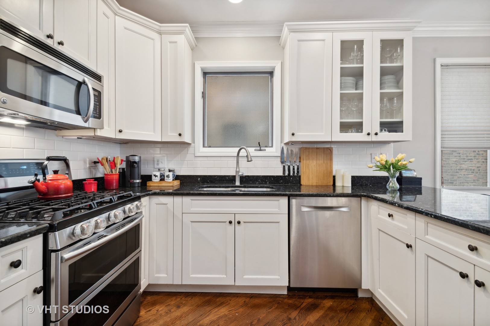 3124 North Seminary Avenue, Unit 1 Chicago, IL 60657 - Photo 6 of 25 a kitchen with stainless steel appliances granite countertop a stove a sink and cabinets