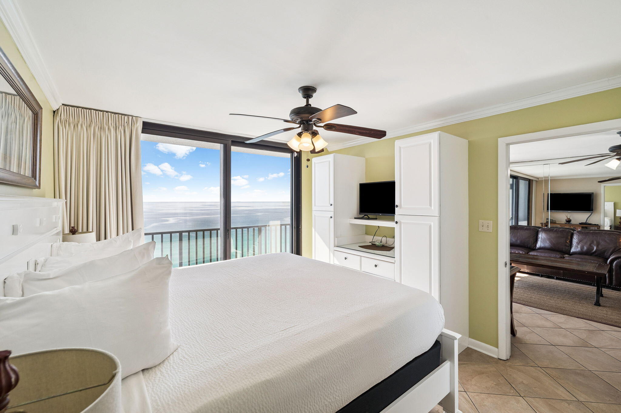 4100 East County Highway 30A, Unit 1606 Santa Rosa Beach, FL 32459 - Photo 19 of 34 a bedroom with a balcony a bed and a chandelier