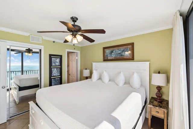 a bed room with a bed and a chandelier