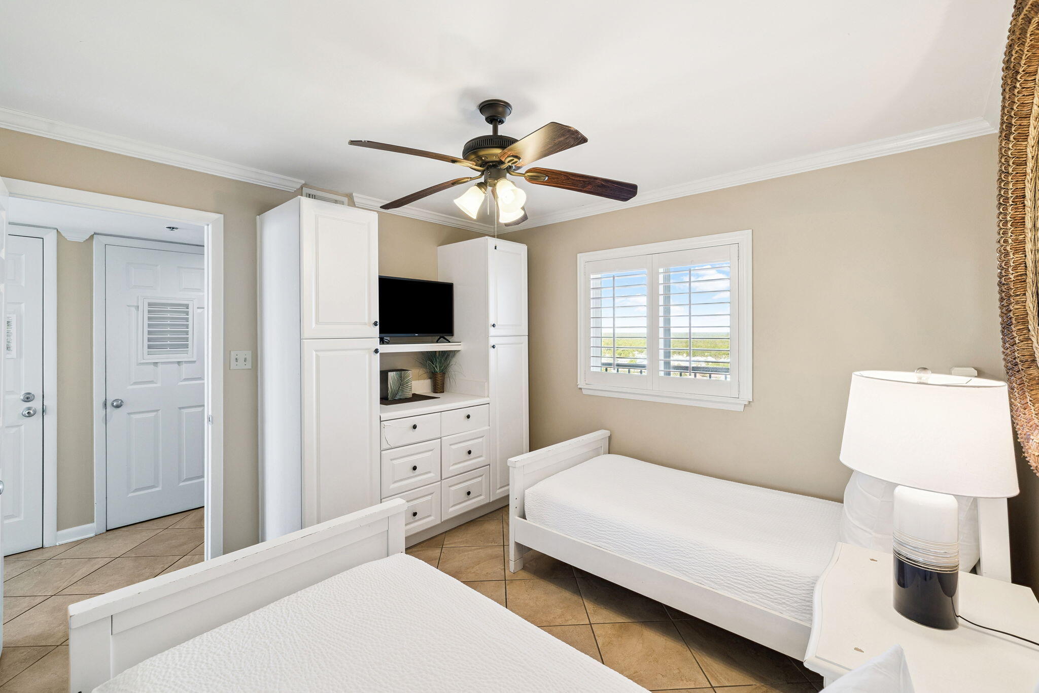 4100 East County Highway 30A, Unit 1606 Santa Rosa Beach, FL 32459 - Photo 23 of 34 a bedroom with a bed and a flat tv screen on dresser