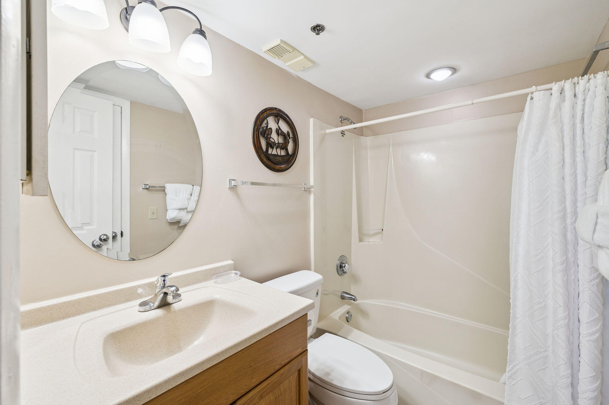 4100 East County Highway 30A, Unit 1606 Santa Rosa Beach, FL 32459 - Photo 24 of 34 a bathroom with a sink a toilet and a mirror