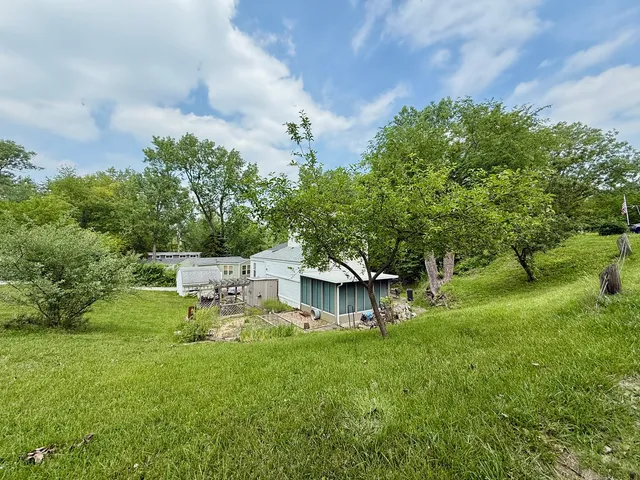 a view of a house with a back yard