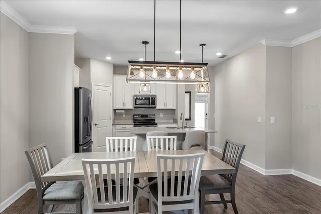 a view of a dining room with furniture