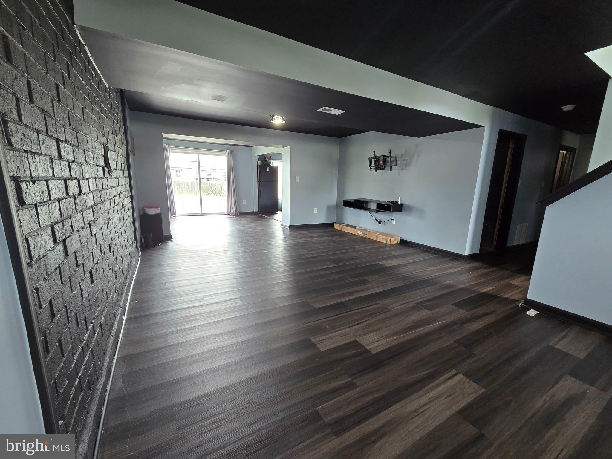 7513 Saffron Court Hanover, MD 21076 - Photo 31 of 42 a view of a hallway with wooden floor