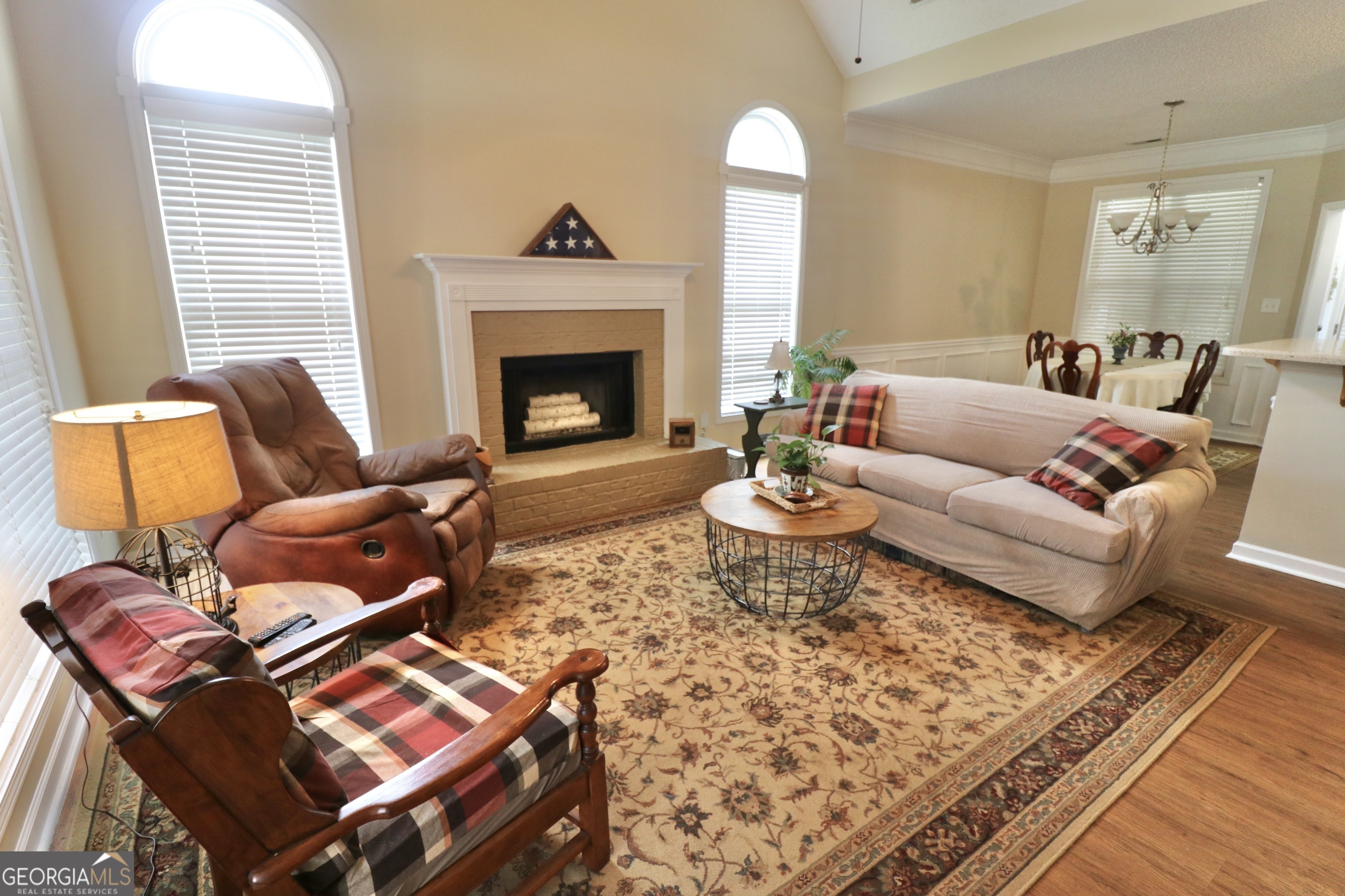 190 Roundtree Way Williamson, GA 30292 - Photo 13 of 73 a living room with furniture and a fireplace