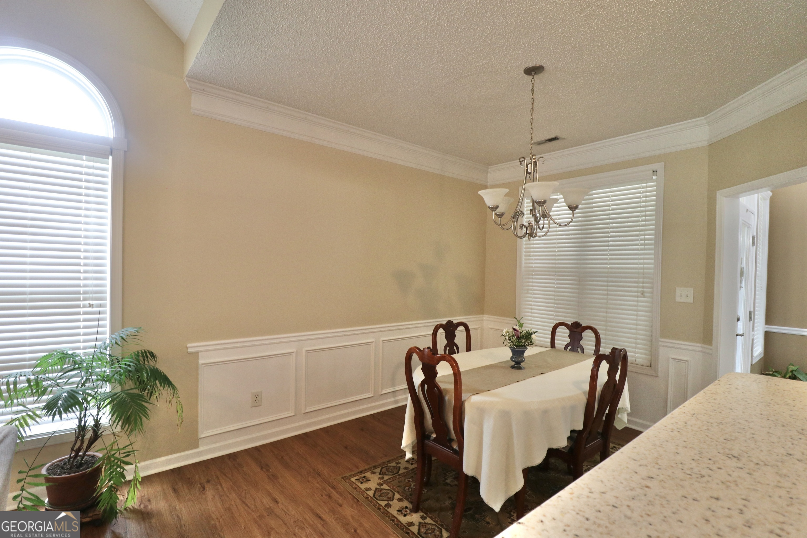 190 Roundtree Way Williamson, GA 30292 - Photo 19 of 73 a view of a dining room with furniture and wooden floor