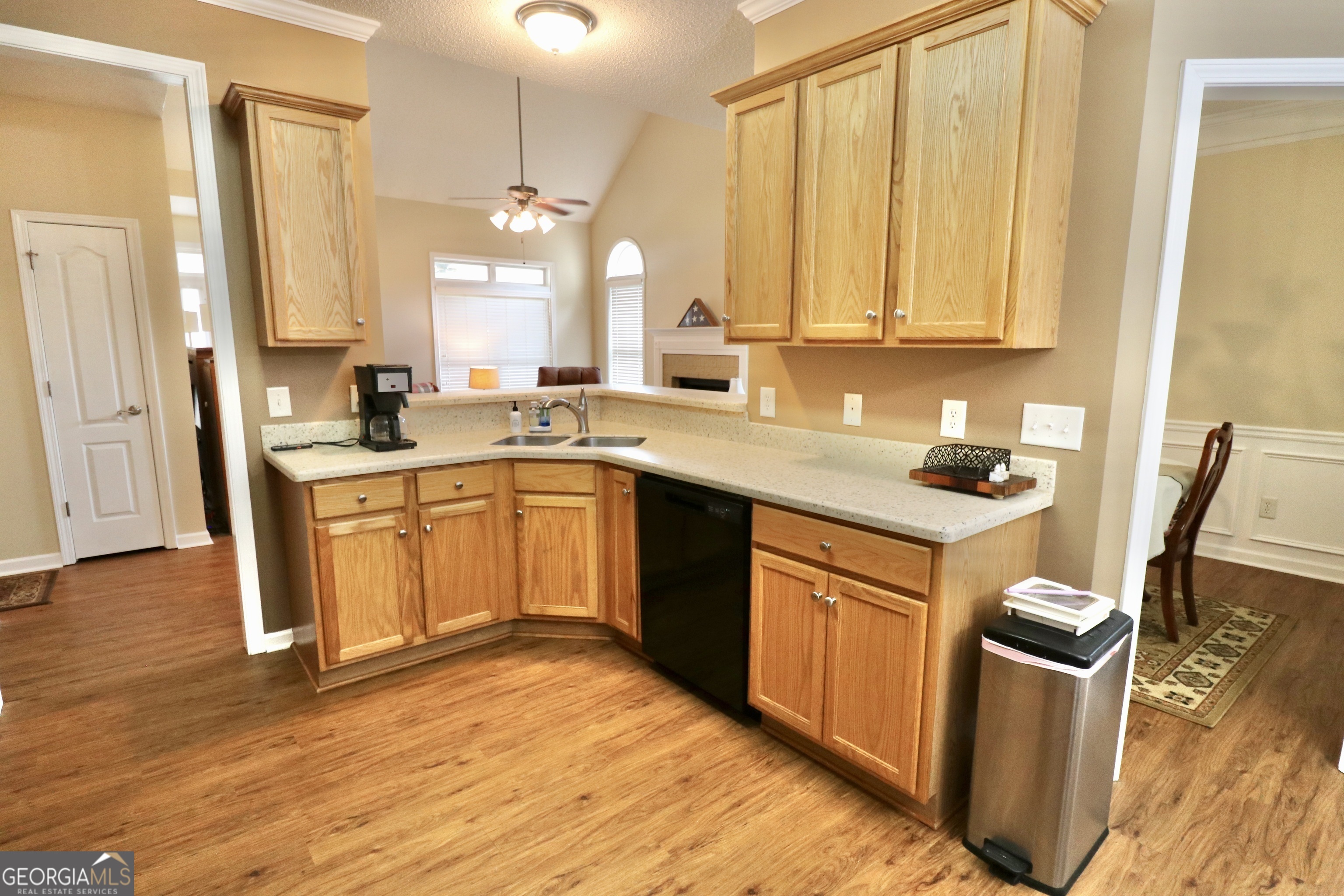 190 Roundtree Way Williamson, GA 30292 - Photo 26 of 73 a kitchen with stainless steel appliances granite countertop a sink stove and refrigerator