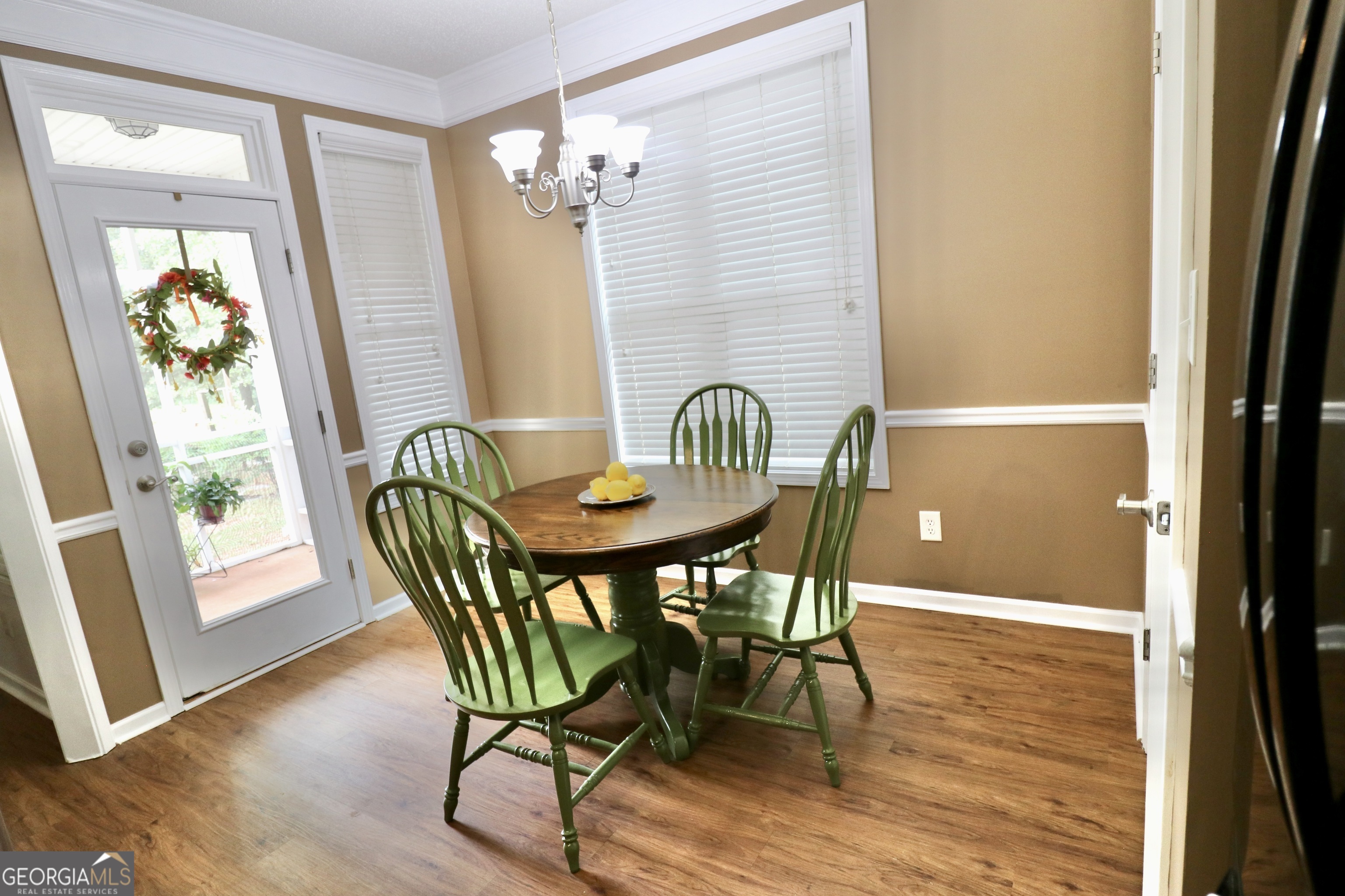 190 Roundtree Way Williamson, GA 30292 - Photo 27 of 73 a view of a dining room with furniture and wooden floor