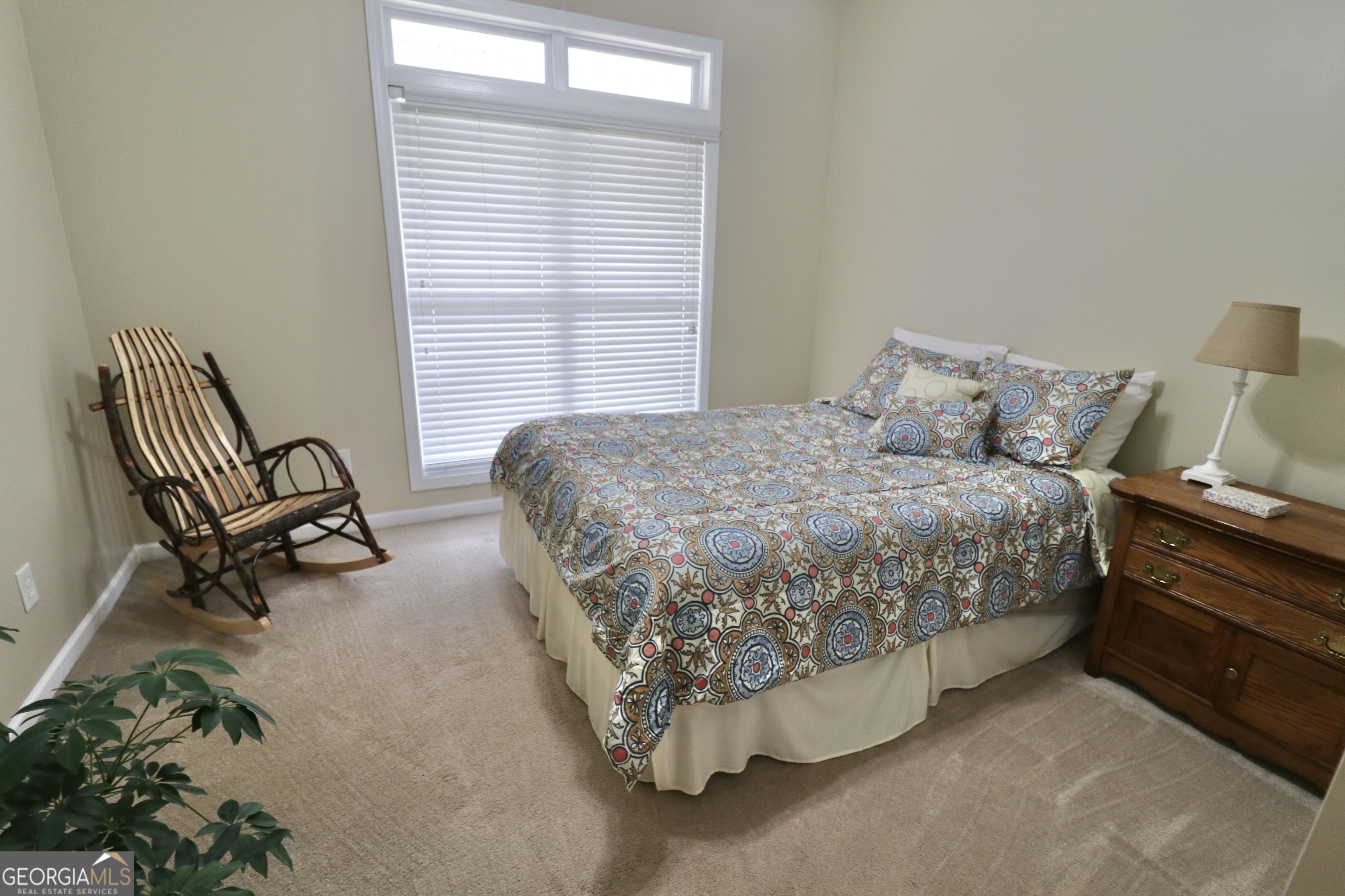 190 Roundtree Way Williamson, GA 30292 - Photo 43 of 73 a bedroom with a bed chair and two windows