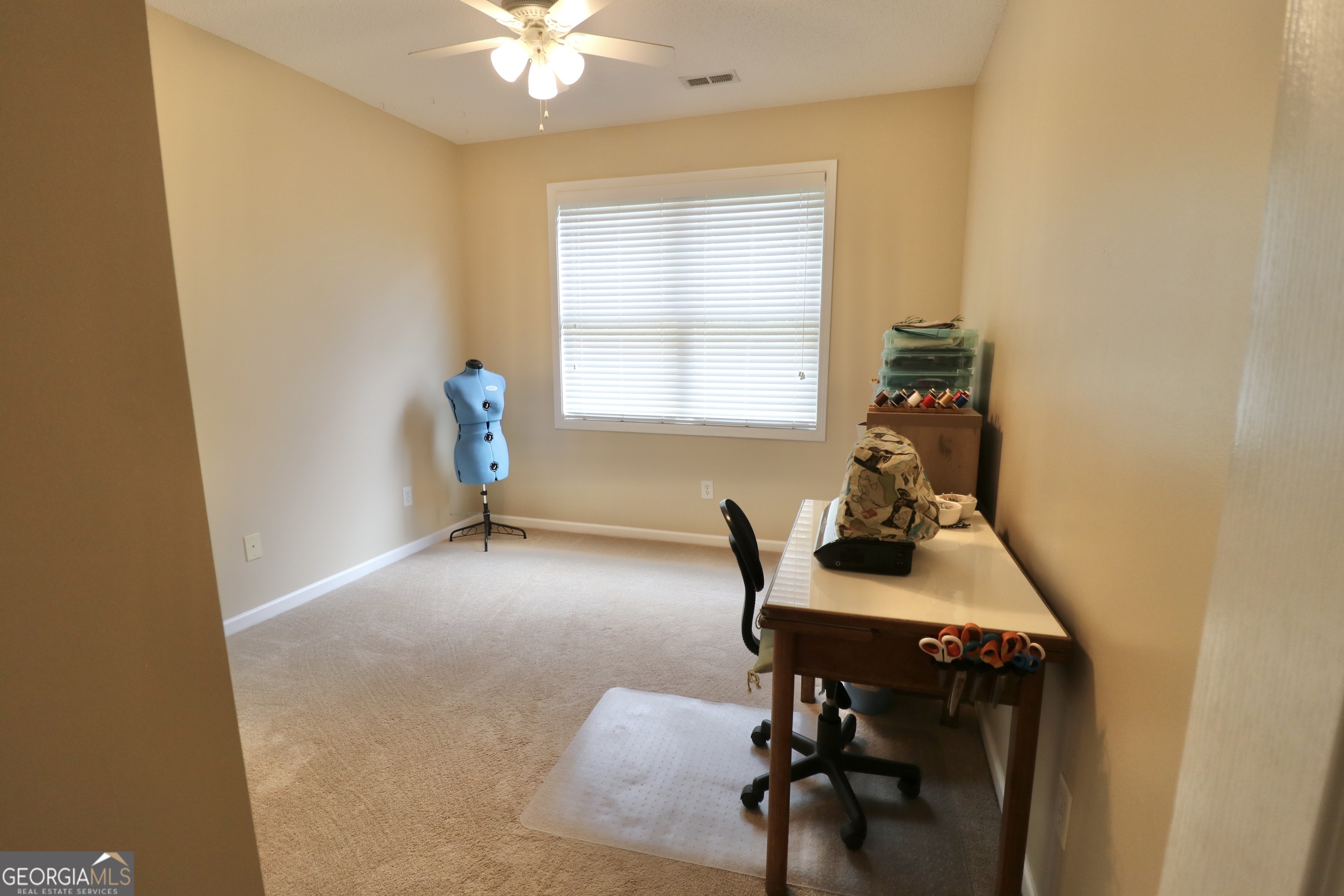 190 Roundtree Way Williamson, GA 30292 - Photo 45 of 73 a workspace with furniture and a window