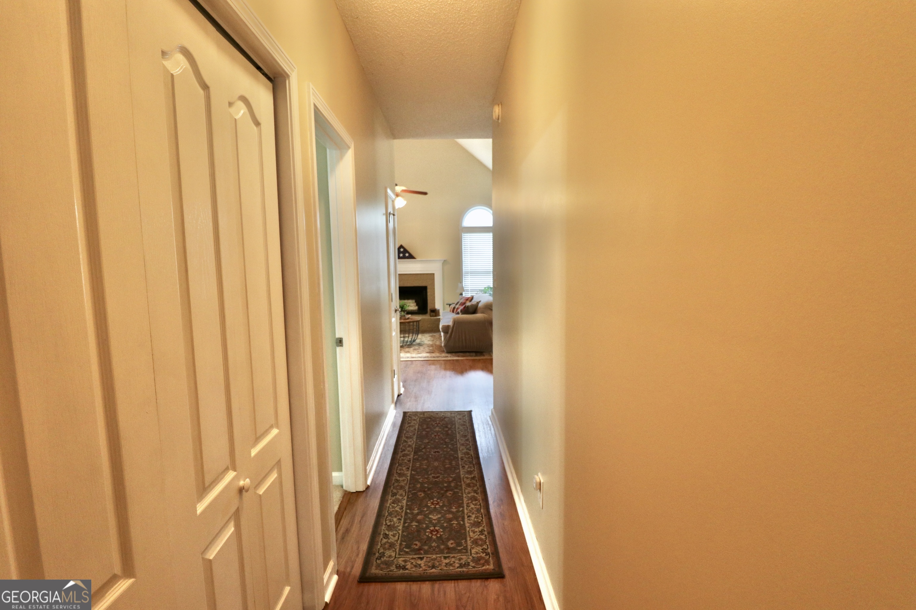 190 Roundtree Way Williamson, GA 30292 - Photo 47 of 73 a view of a hallway with wooden floor and a bathroom with sink