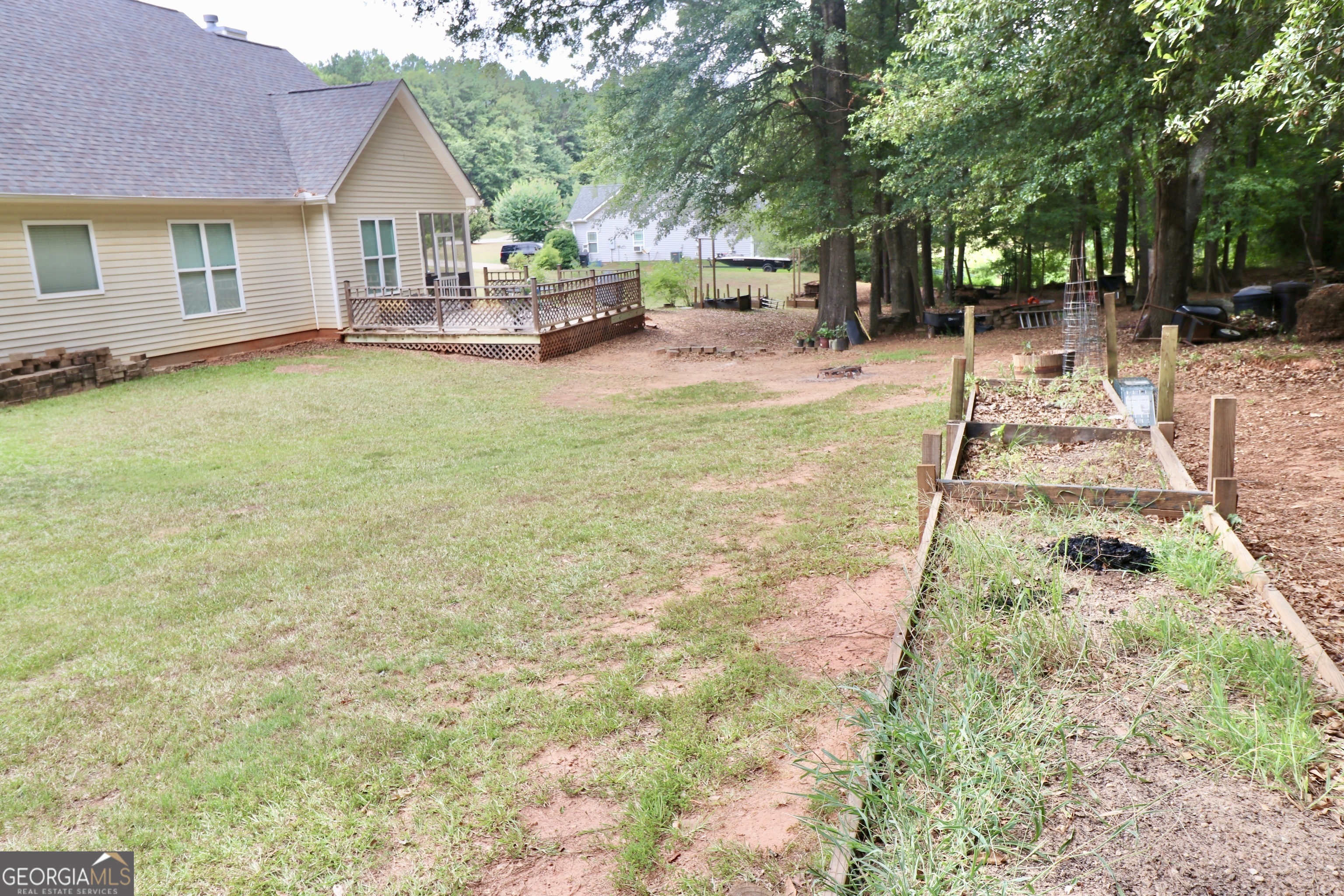 190 Roundtree Way Williamson, GA 30292 - Photo 64 of 73 a view of a house with a yard and sitting area
