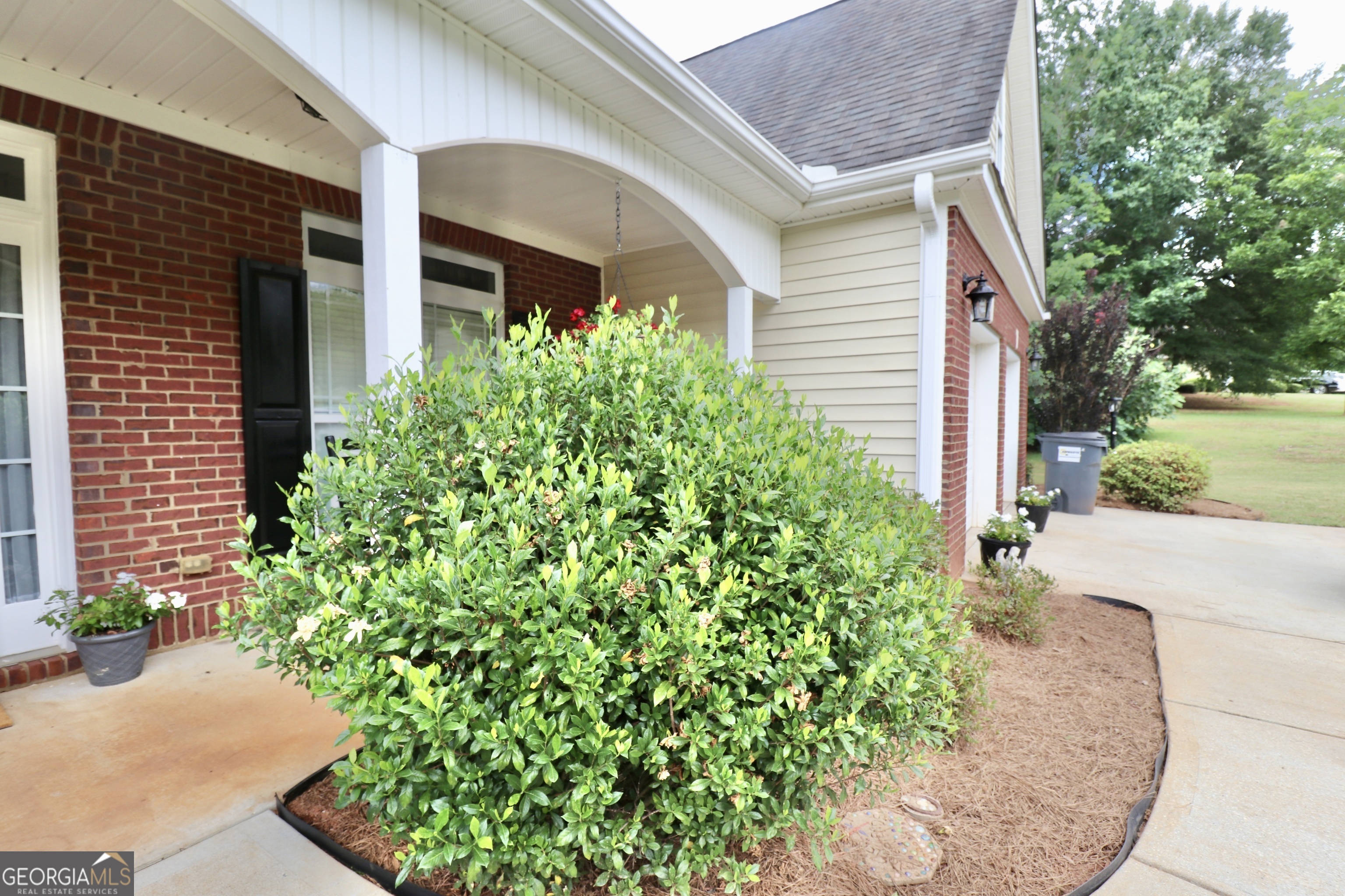 190 Roundtree Way Williamson, GA 30292 - Photo 9 of 73 a view of a house with a flower garden