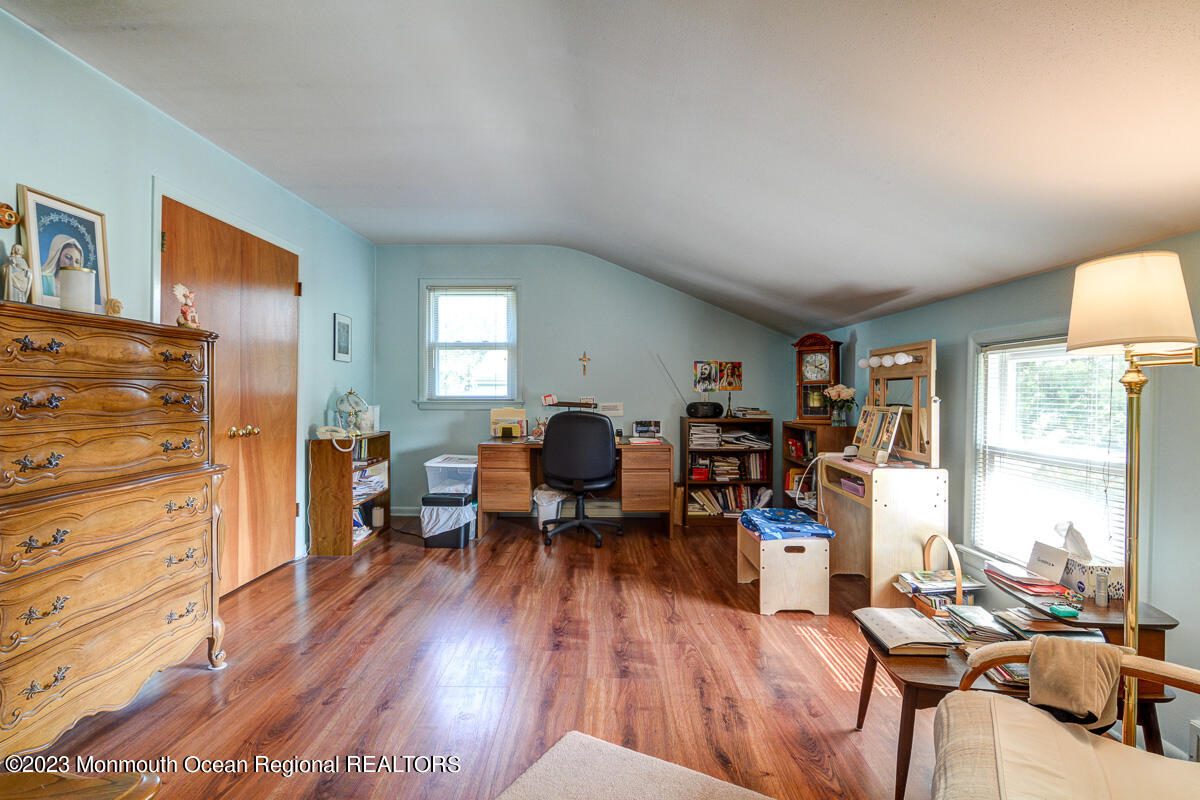 38 Ryan Boulevard Freehold, NJ 07728 - Photo 21 of 22 a living room with furniture and a wooden floor