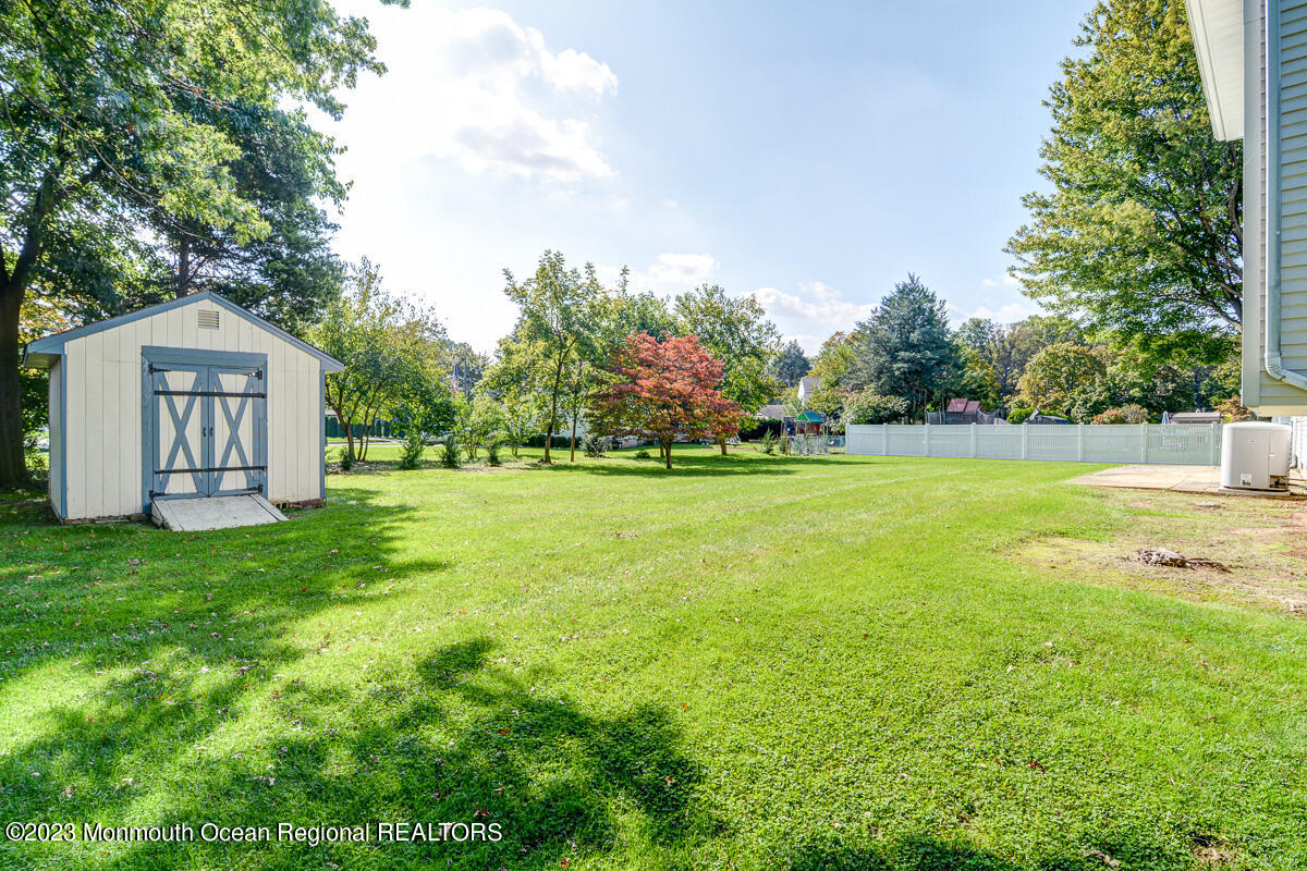 38 Ryan Boulevard Freehold, NJ 07728 - Photo 5 of 22 a front view of a house with garden