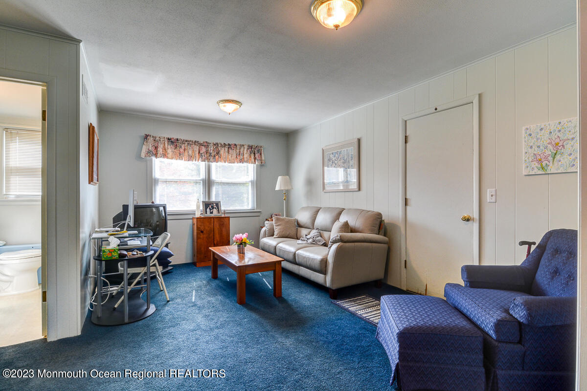 38 Ryan Boulevard Freehold, NJ 07728 - Photo 7 of 22 a living room with furniture and a window