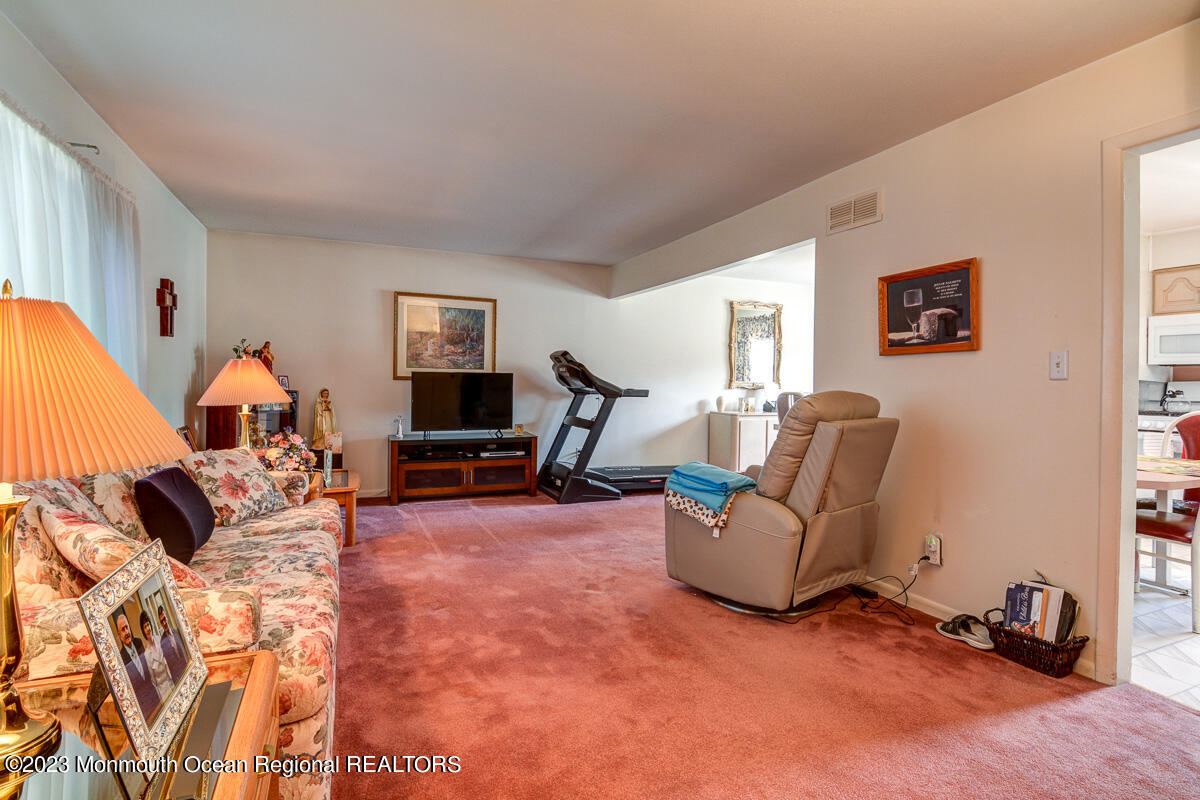 38 Ryan Boulevard Freehold, NJ 07728 - Photo 9 of 22 a living room with furniture and a flat screen tv