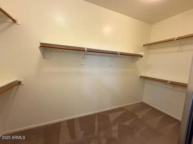 a view of an empty walk in closet