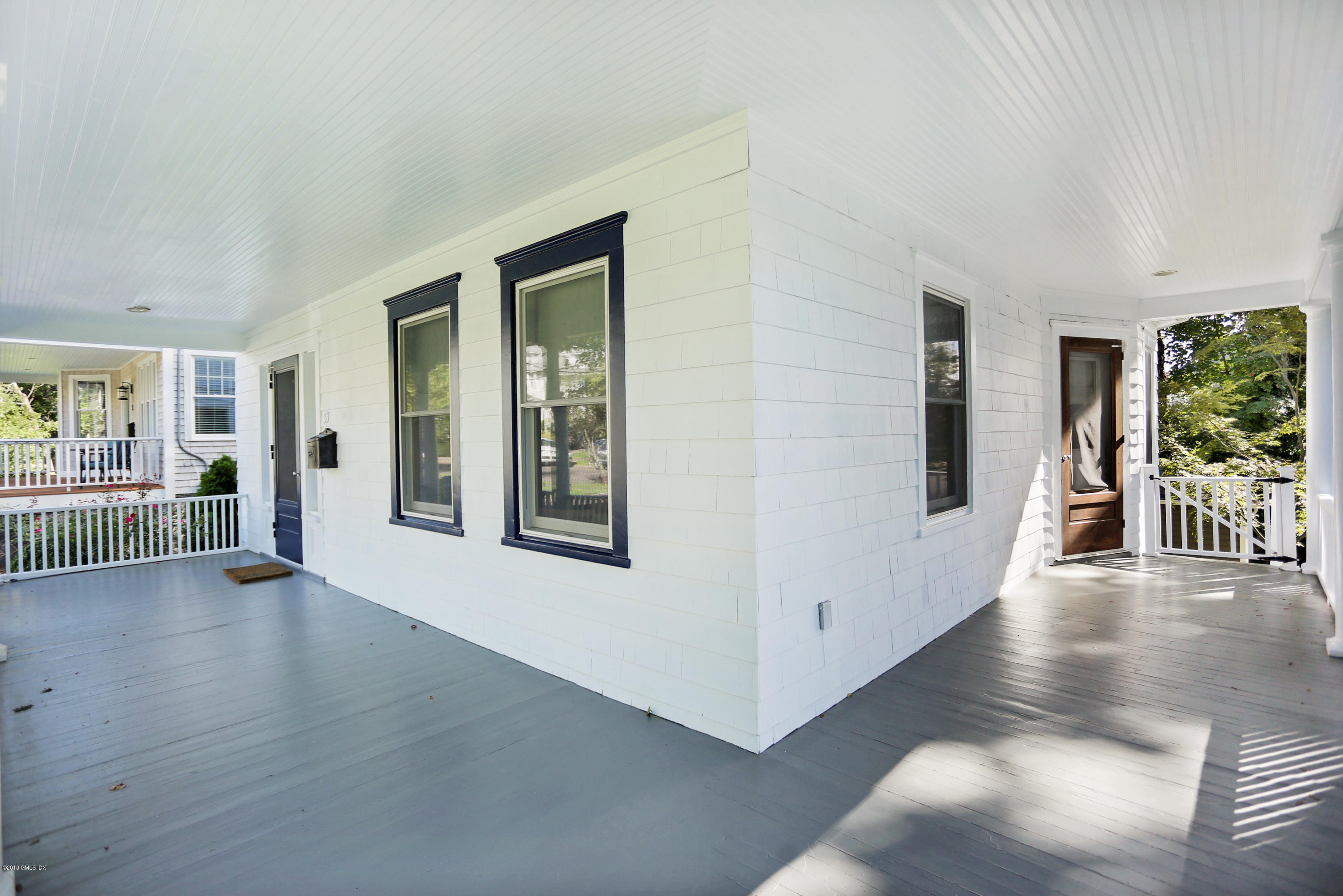 53 Ridge Street Greenwich, CT 06830 - Photo 17 of 17 a view of a porch with wooden floor and windows