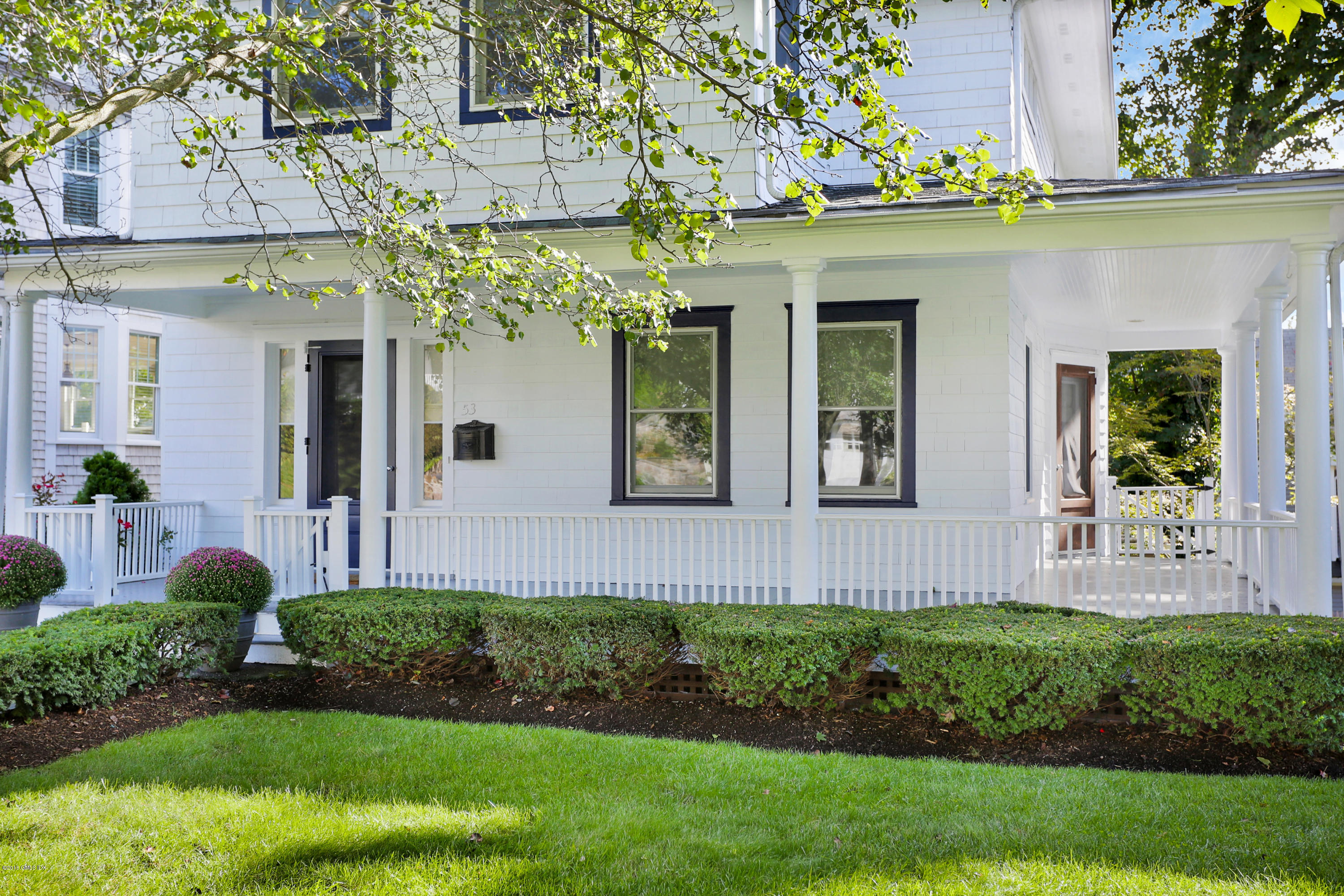 53 Ridge Street Greenwich, CT 06830 - Photo 2 of 17 a front view of a house with a yard