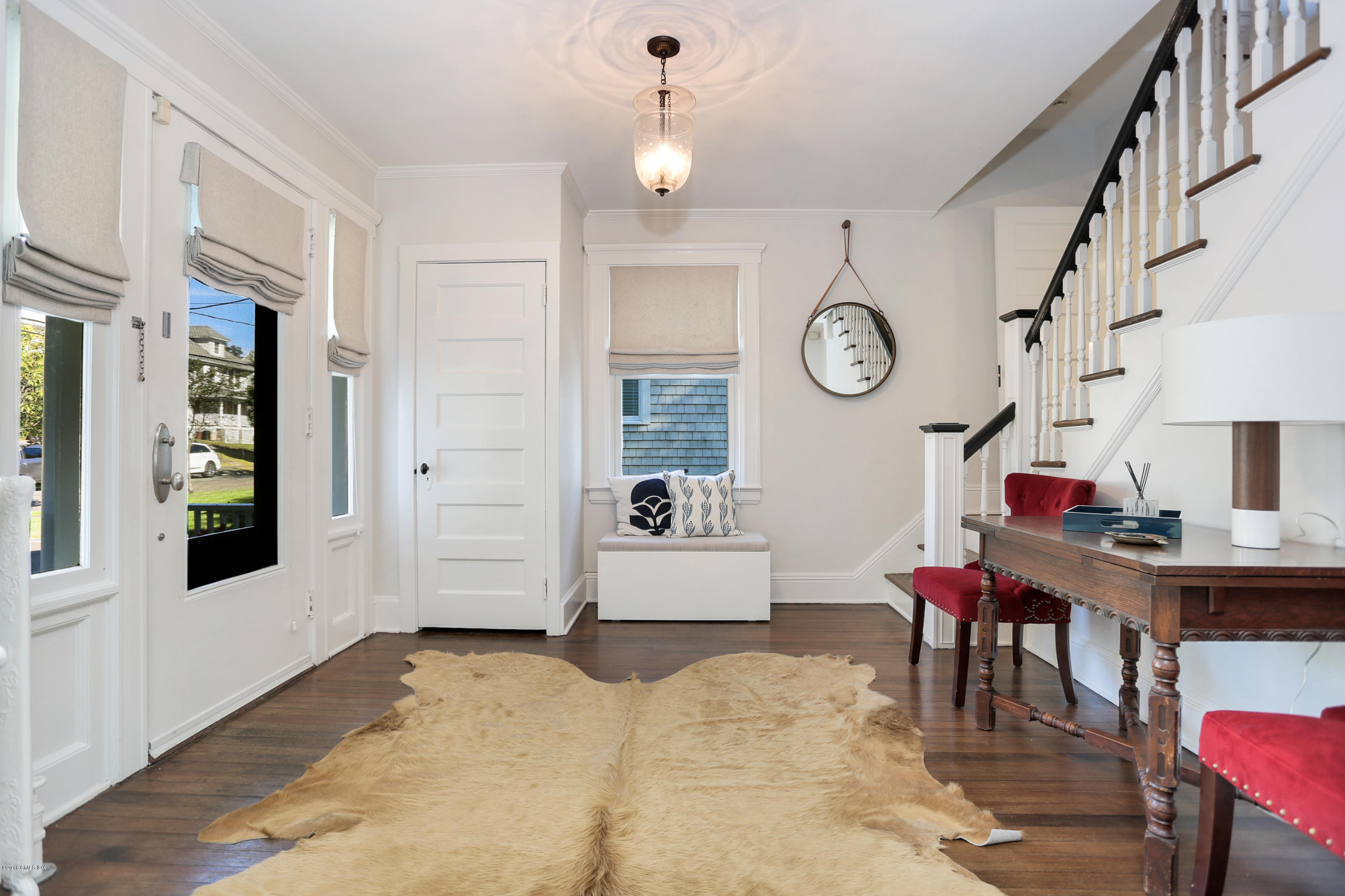 53 Ridge Street Greenwich, CT 06830 - Photo 4 of 17 a very nice looking room with a table and a chair