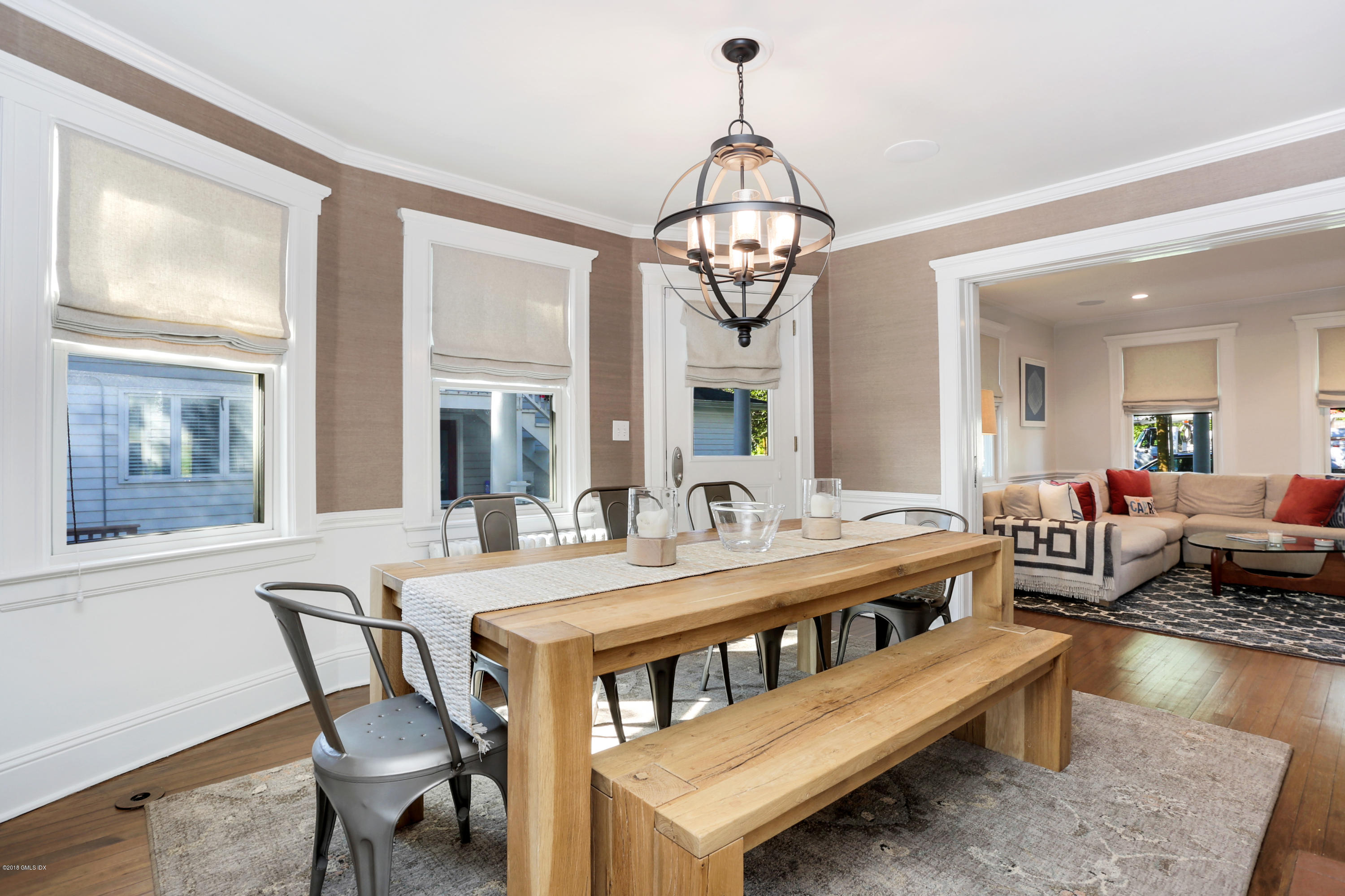 53 Ridge Street Greenwich, CT 06830 - Photo 6 of 17 a view of a dining room with furniture wooden floor and chandelier