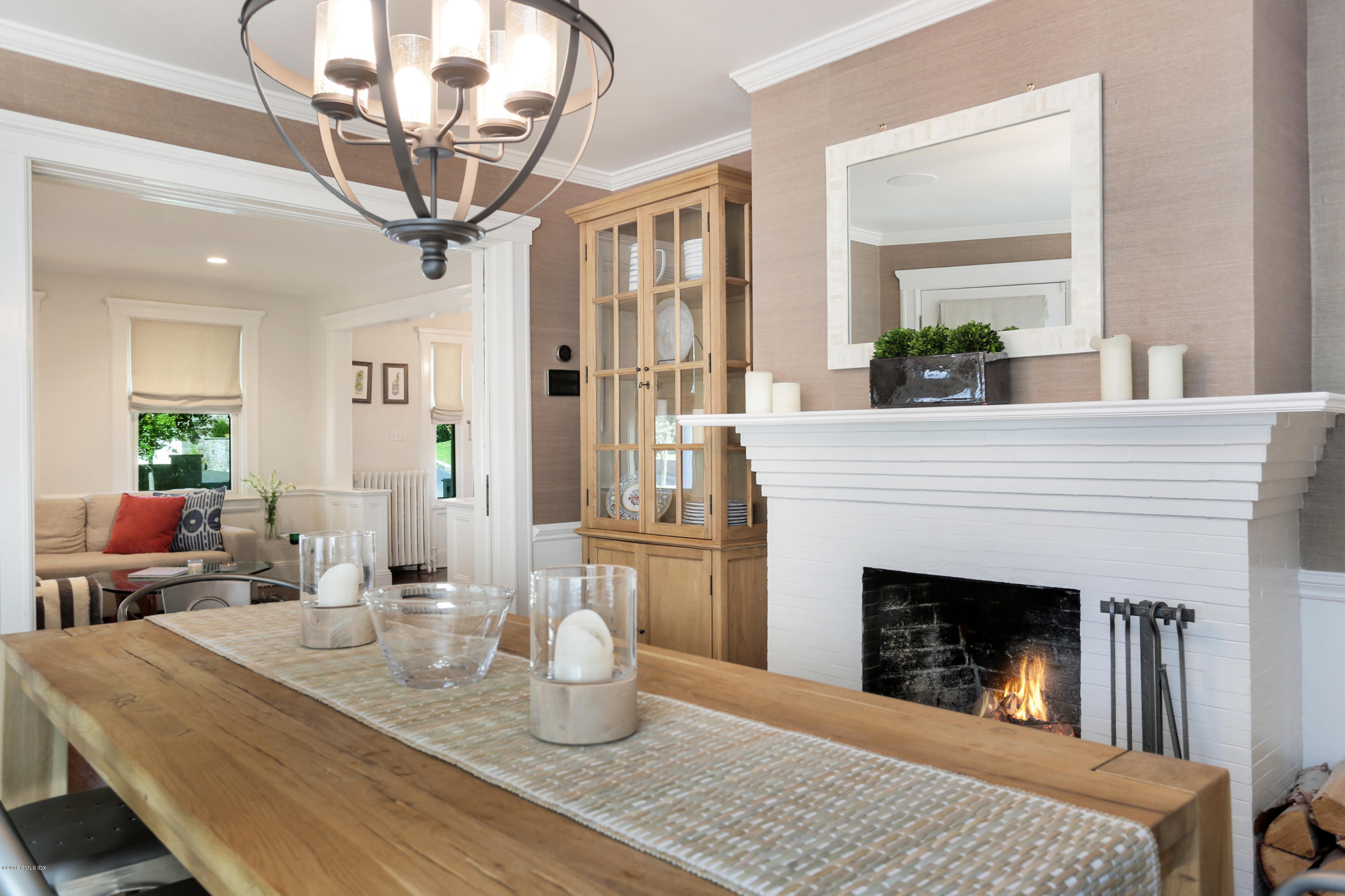 53 Ridge Street Greenwich, CT 06830 - Photo 7 of 17 a living room with furniture and a fireplace