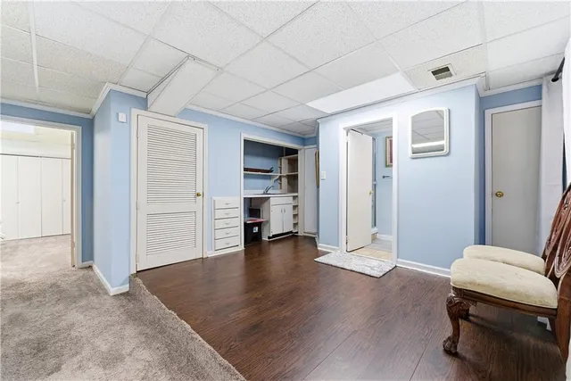 a view of a livingroom with hardwood and furniture