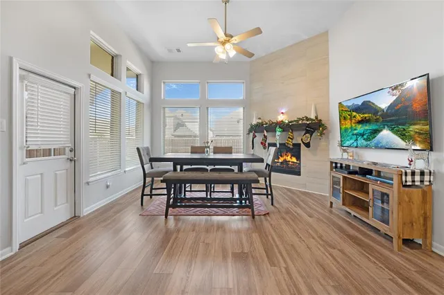 a view of a dining room with furniture window and wooden floor