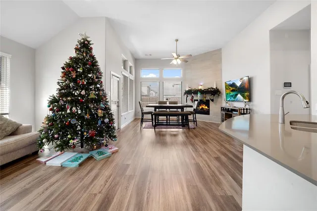 a living room with furniture and a kitchen