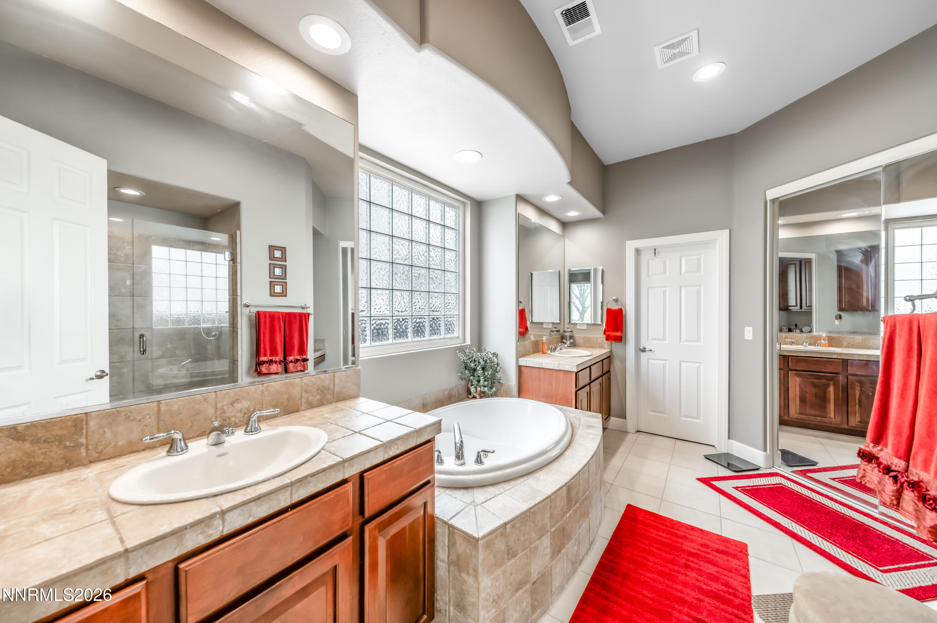 5865 Slate Drive Reno, NV 89523 - Photo 13 of 23 a spacious bathroom with a double vanity sink and a mirror