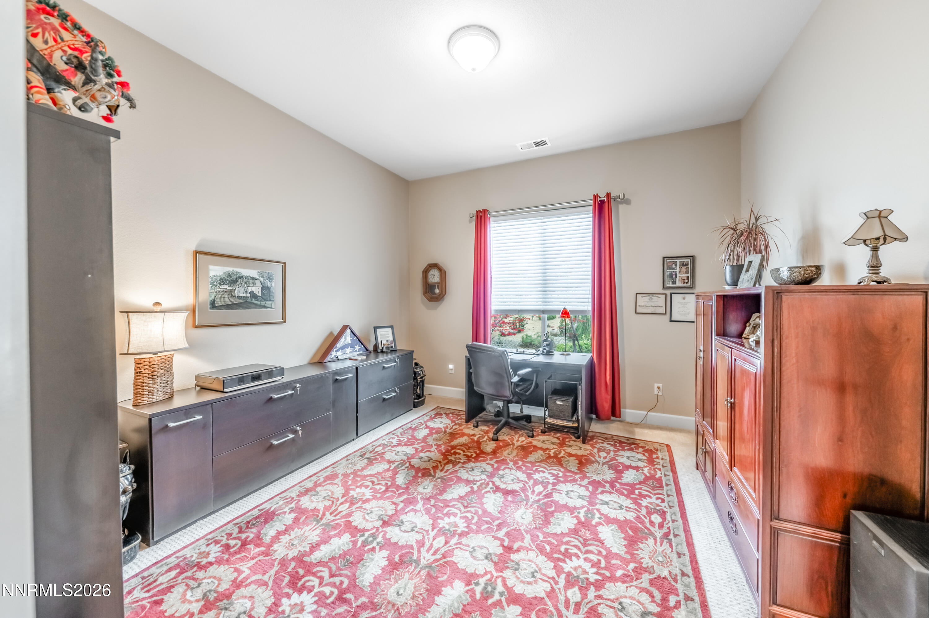 5865 Slate Drive Reno, NV 89523 - Photo 15 of 23 a bed room with a bed and a television